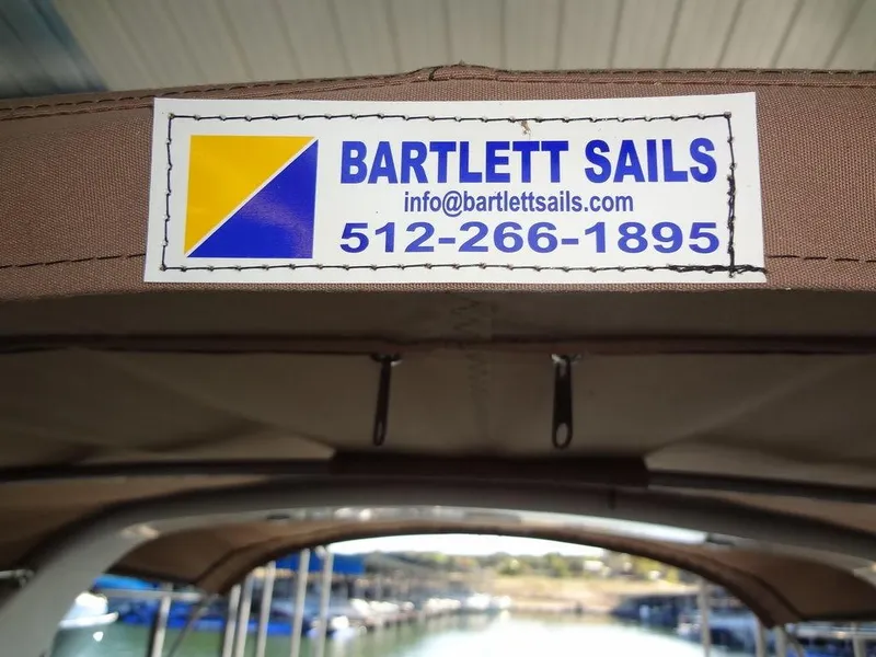 Slide: The Image of Sea Ray 340 Sundancer 2000 with Bartlett Sails label and contact information. - 43