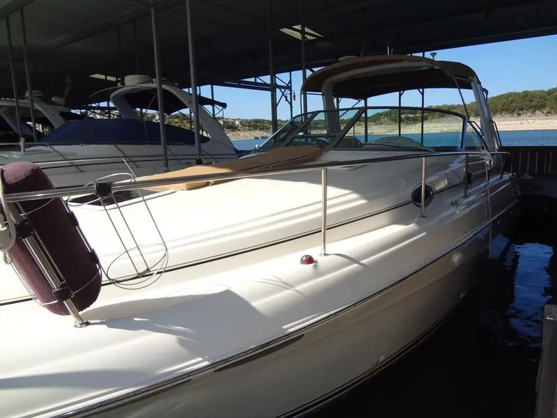 Slide: The Image of 2000 Sea Ray 340 Sundancer docked under a covered marina. - 6