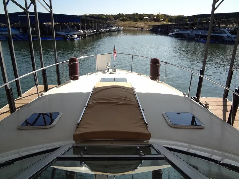 Slide: The Image of 2000 Sea Ray 340 Sundancer docked at marina, view from bow. - 8