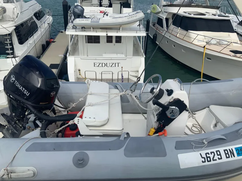 Slide: The Image of 1979 Hatteras 53 Motor Yacht docked with inflatable boat in foreground. - 19