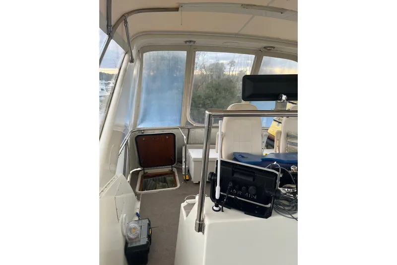Slide: The Image of Interior view of 1979 Hatteras 53 Motor Yacht with helm and seating area. - 28