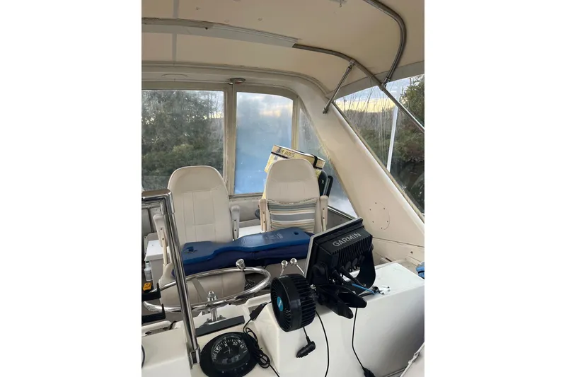 Slide: The Image of Interior of 1979 Hatteras 53 Motor Yacht with Garmin navigation system and seating. - 29