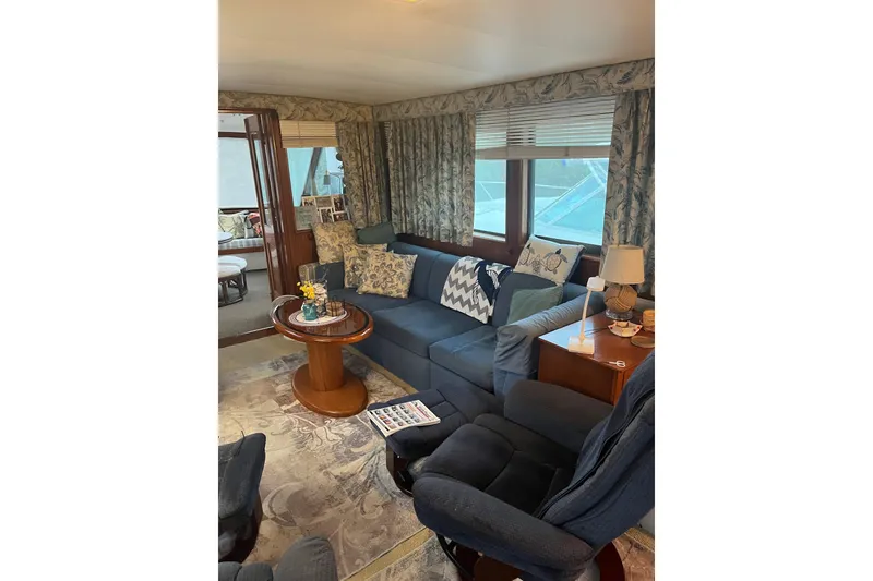 Slide: The Image of Interior of 1979 Hatteras 53 Motor Yacht with cozy seating and nautical decor. - 35