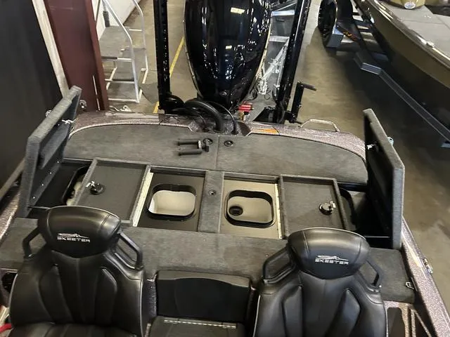 Slide: The Image of 2024 Skeeter ZXR 21 boat interior with Yamaha 250HP SHO engine, featuring storage compartments. - 13
