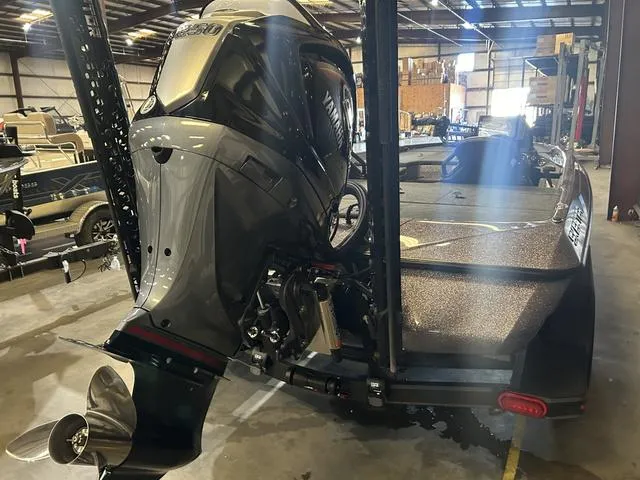 Slide: The Image of 2024 Skeeter ZXR 21 boat with Yamaha 250HP SHO engine in a warehouse. - 3