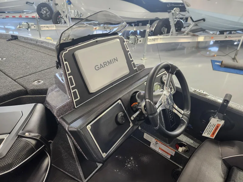 Slide: The Image of 2025 Ranger Z520R boat dashboard with Garmin navigation system. - 16