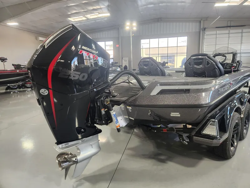 Slide: The Image of 2025 Ranger Z520R Garmin boat with Mercury 250 engine in showroom. - 2