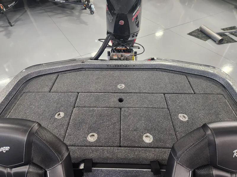 Slide: The Image of 2025 Ranger Z520R Garmin Ranger Cup boat deck with storage compartments and motor. - 20