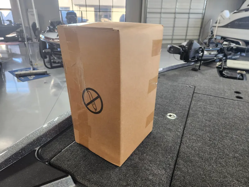 Slide: The Image of Cardboard box on 2025 Ranger Z520R Garmin Ranger Cup boat deck. - 26