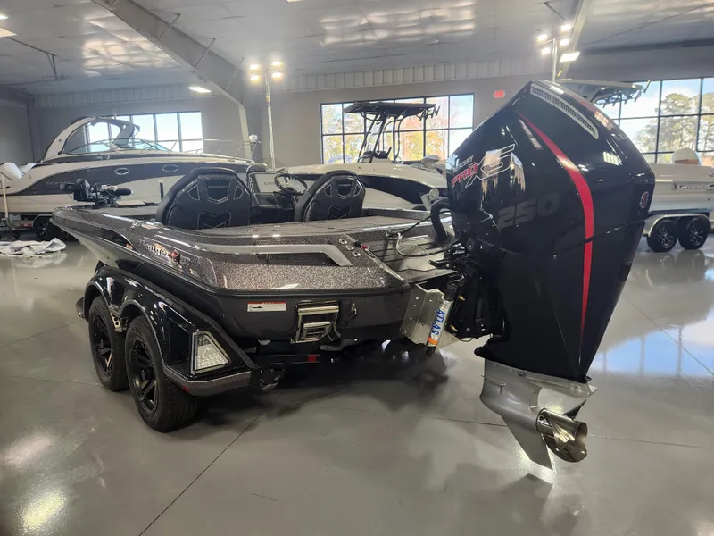 Slide: The Image of 2025 Ranger Z520R Garmin Ranger Cup boat in showroom, rear view with powerful outboard motor. - 4