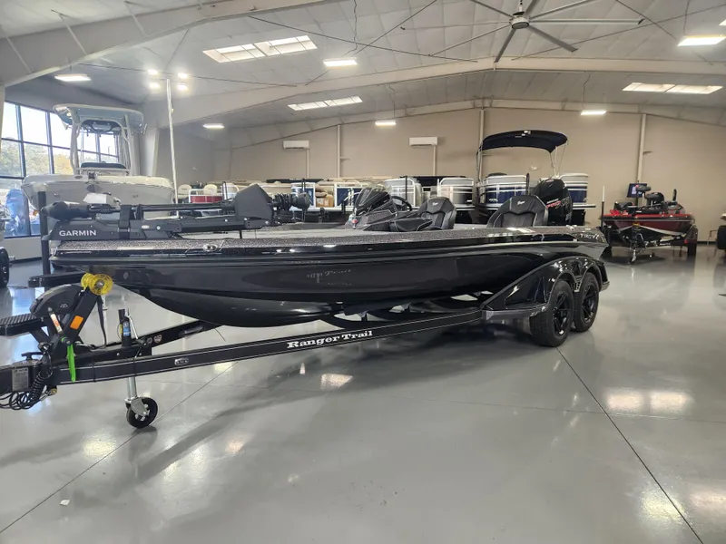 Slide: The Image of 2025 Ranger Z520R Garmin Ranger Cup boat in showroom, sleek design on trailer. - 5
