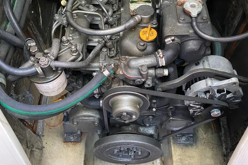 Slide: The Image of Engine compartment of a 2003 Catalina 42 MkII sailboat, showing detailed mechanical components. - 22