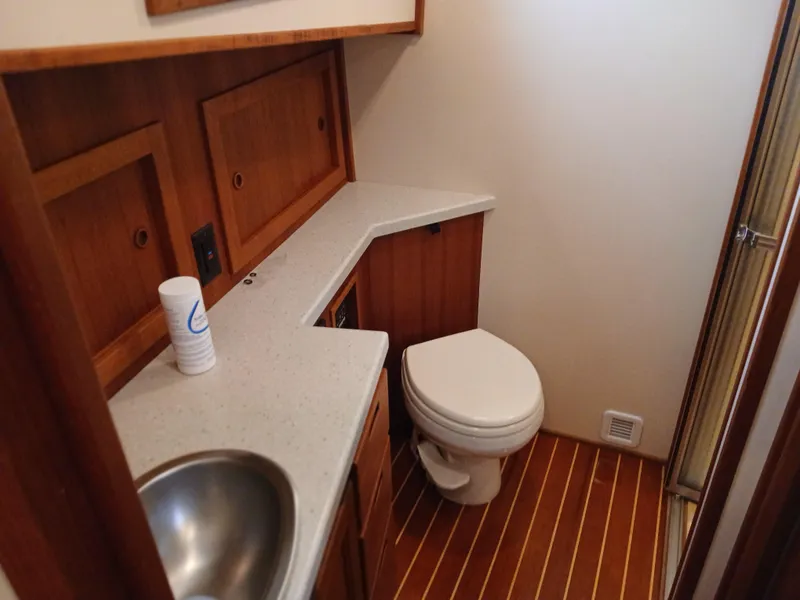 Slide: The Image of Bathroom interior of 2007 Nordic Tug 37 with wooden cabinetry and modern fixtures. - 30