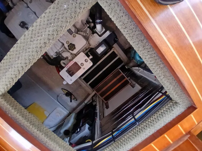 Slide: The Image of Engine room of a 2007 Nordic Tug 37, showing mechanical components and wiring. - 33