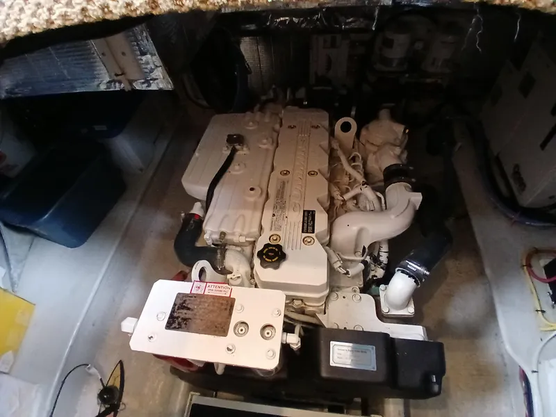 Slide: The Image of Engine compartment of a 2007 Nordic Tug 37 boat, showcasing mechanical components. - 34
