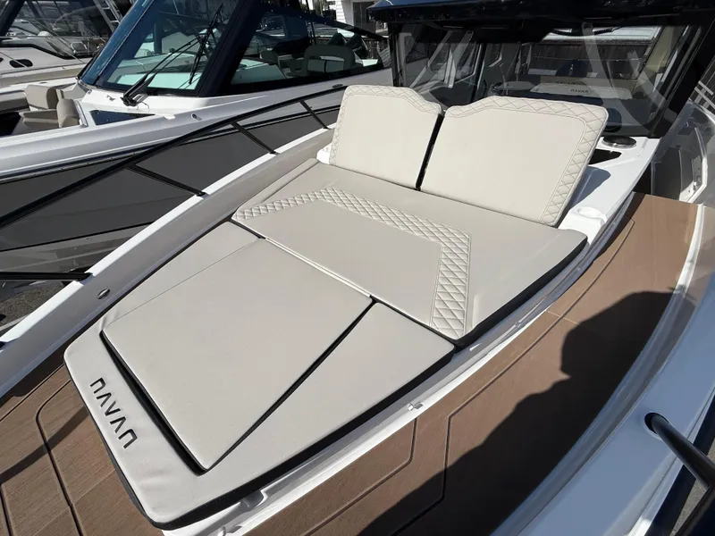 Slide: The Image of 2025 Navan C30 boat with luxurious sunbathing deck and modern design. - 9