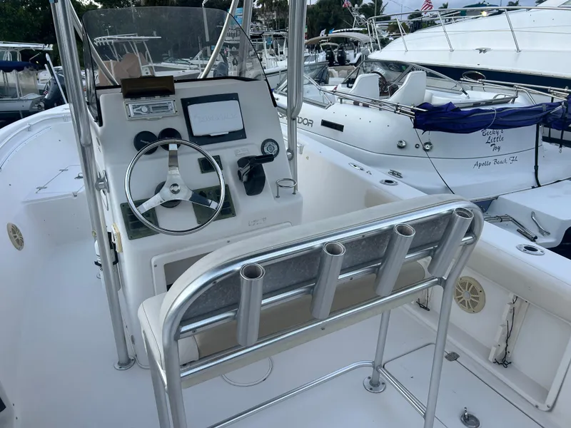 Slide: The Image of 2009 Cobia 216 Center Console boat interior with steering wheel and control panel. - 3