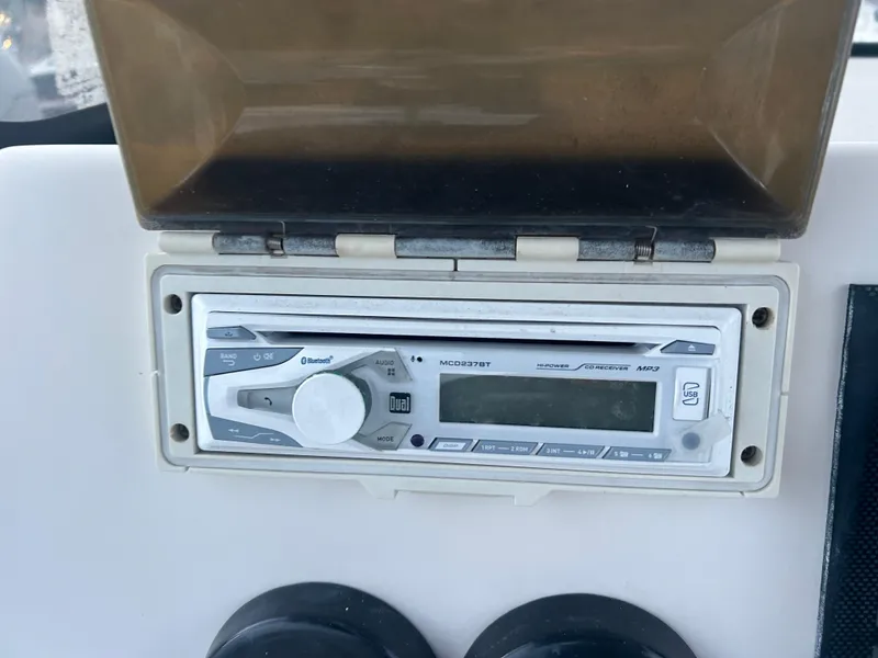 Slide: The Image of Boat stereo system on 2009 Cobia 216 Center Console. - 8