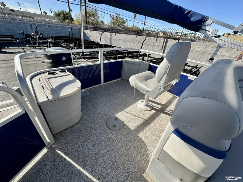 Slide: The Image of 2021 Bennington 20SV pontoon boat interior with seating and storage compartments. - 6