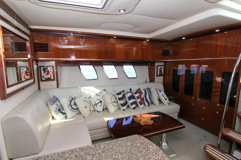 Slide: The Image of Luxurious interior of 2008 Sea Ray 48 Sundancer yacht with plush seating and nautical decor. - 10