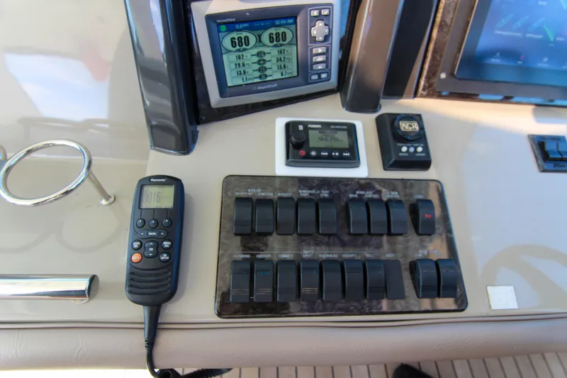 Slide: The Image of Control panel of a 2008 Sea Ray 48 Sundancer yacht with navigation instruments. - 18