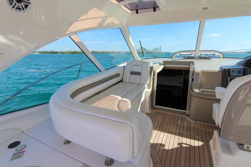 Slide: The Image of 2008 Sea Ray 48 Sundancer yacht interior with plush seating and ocean view. - 25