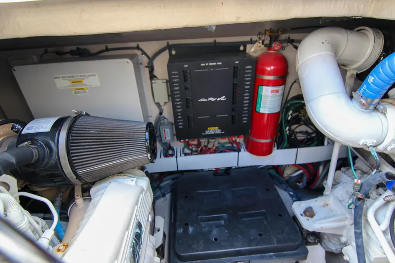 Slide: The Image of Engine room of 2008 Sea Ray 48 Sundancer with fire extinguisher and electrical components. - 29