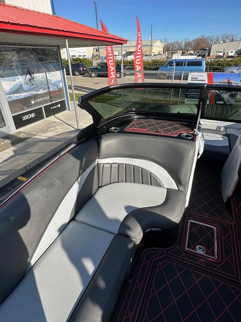 Slide: The Image of Interior of 2022 MB Tomcat F22 Alpha boat with stylish seating and red accents. - 15