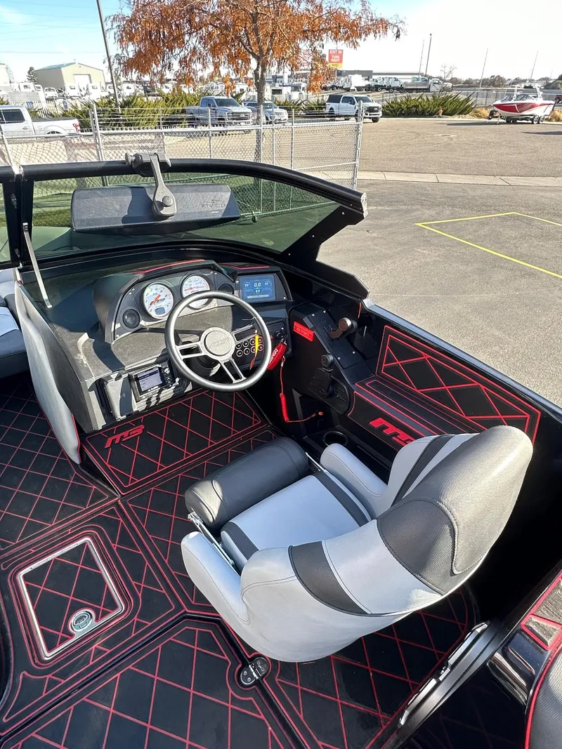 Slide: The Image of 2022 MB Tomcat F22 Alpha boat interior with steering wheel and dashboard. - 16