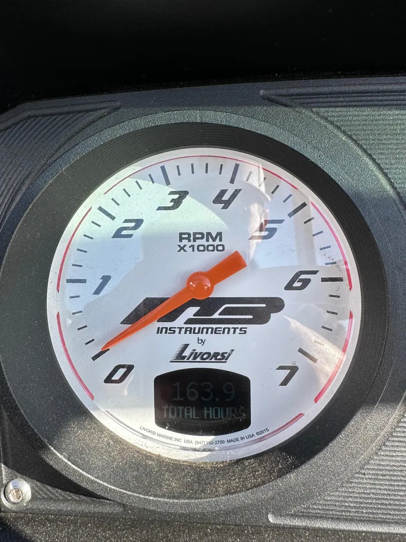 Slide: The Image of Tachometer of MB Tomcat F22 Alpha 2022 showing 163.9 total hours. - 18