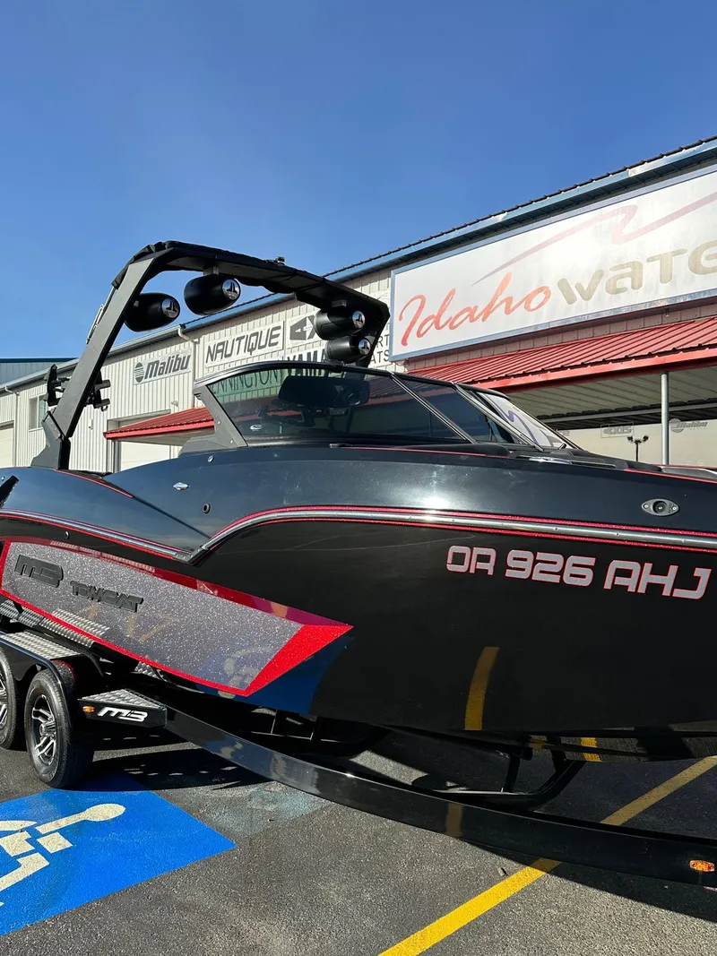 Slide: The Image of 2022 MB Tomcat F22 Alpha boat parked at Idaho Water Sports dealership. - 3