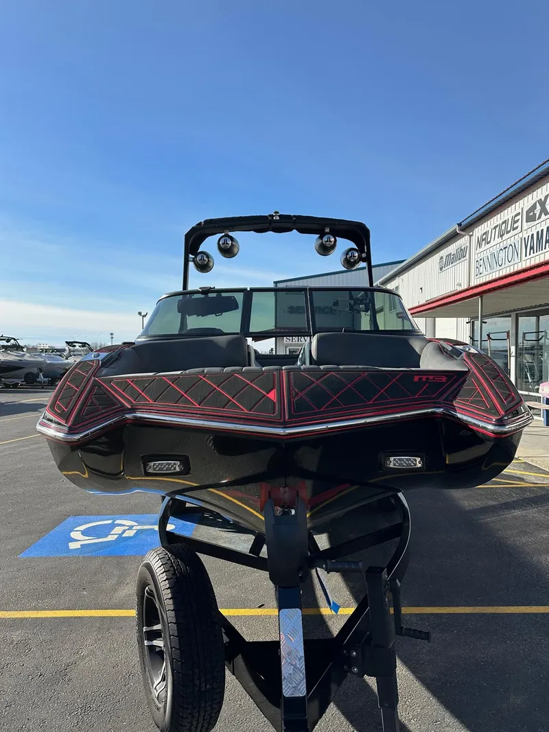 Slide: The Image of 2022 MB Tomcat F22 Alpha boat on trailer at dealership parking lot. - 4