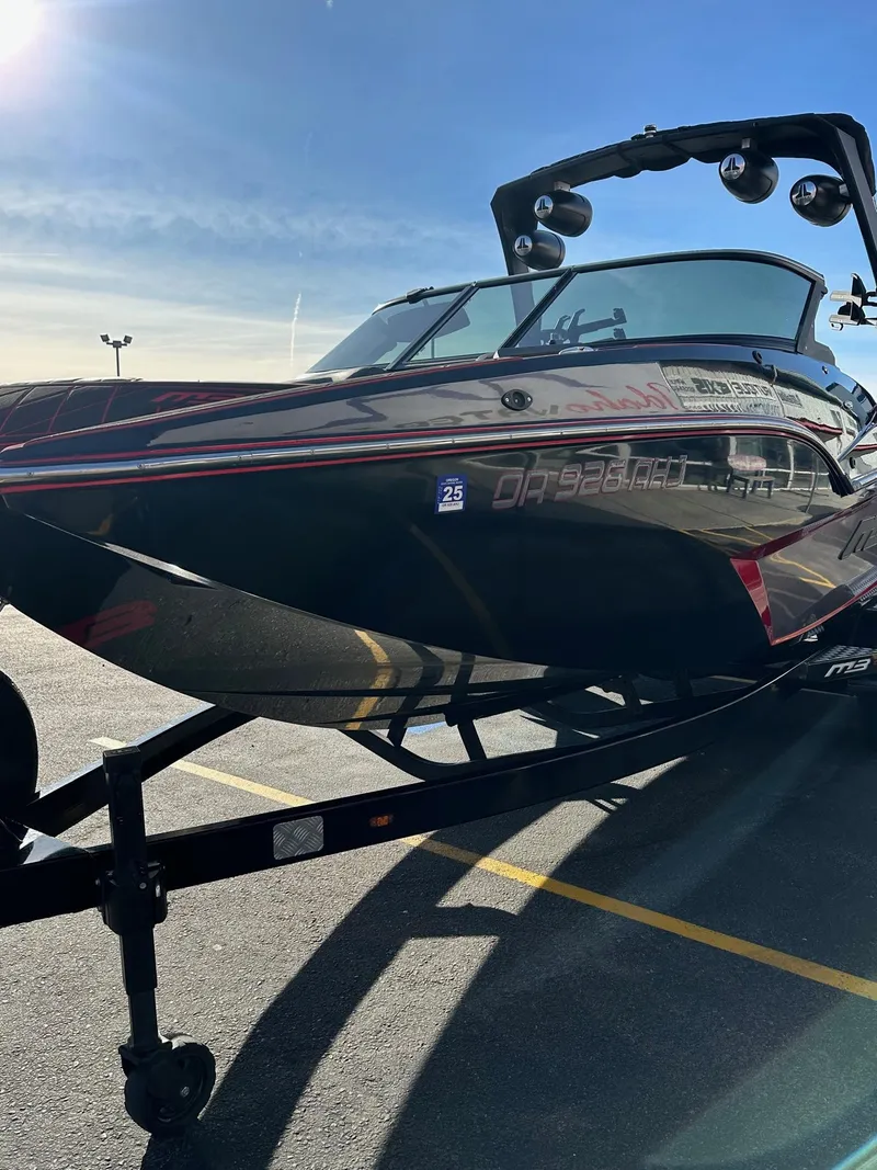 Slide: The Image of 2022 MB Tomcat F22 Alpha boat on trailer in parking lot. - 5