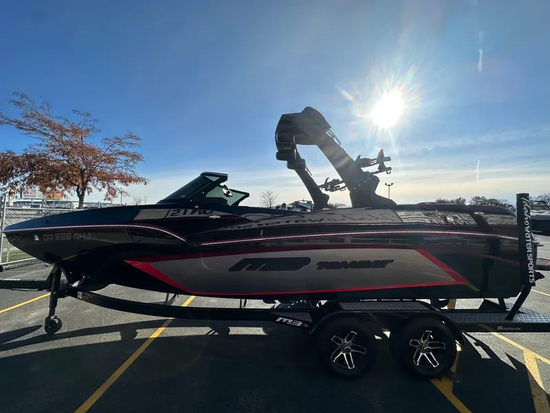 Slide: The Image of 2022 MB Tomcat F22 Alpha boat on trailer under bright sun. - 6