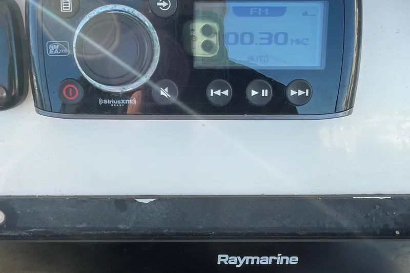 Slide: The Image of Sailfish 240 boat dashboard with Raymarine and SiriusXM radio, 2015 model. - 15