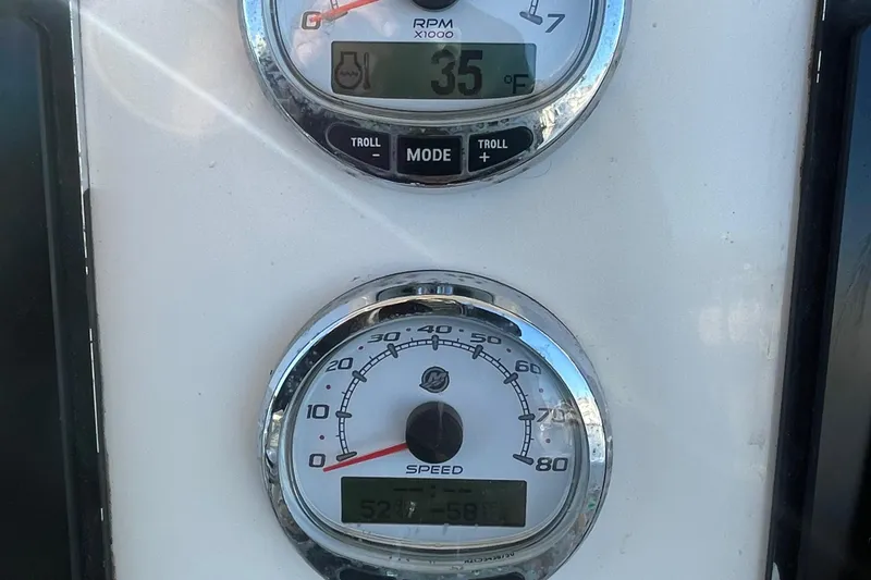 Slide: The Image of Close-up of Sailfish 240 boat gauges displaying RPM and speed, 2015 model. - 16
