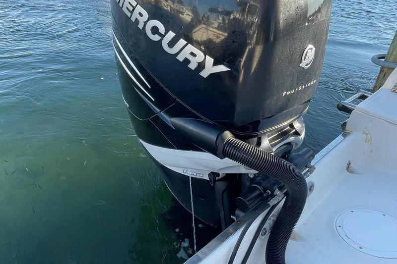Slide: The Image of Sailfish 240 boat with Mercury outboard motor in water, 2015 model. - 18