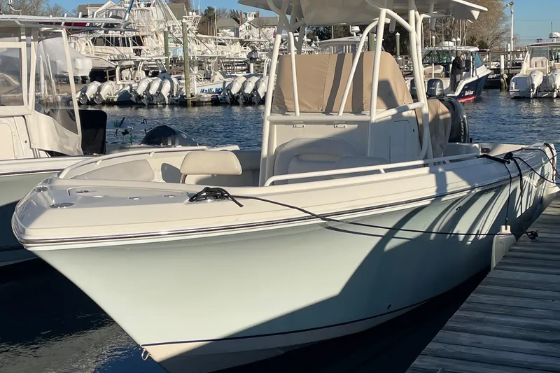 Slide: The Image of 2015 Sailfish 240 boat docked at marina, sunny day, calm waters. - 20