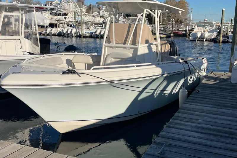 Slide: The Image of 2015 Sailfish 240 boat docked at marina, clear sunny day. - 6