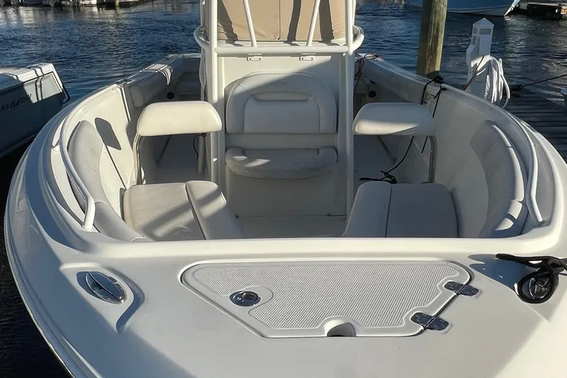 Slide: The Image of 2015 Sailfish 240 boat interior with seating, docked at marina. - 7