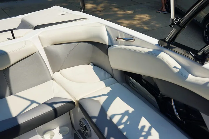 Slide: The Image of 2014 Tigé R20 boat interior with white and gray seating. - 14