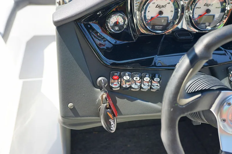 Slide: The Image of Close-up of 2014 Tigé R20 boat dashboard with gauges and key. - 15