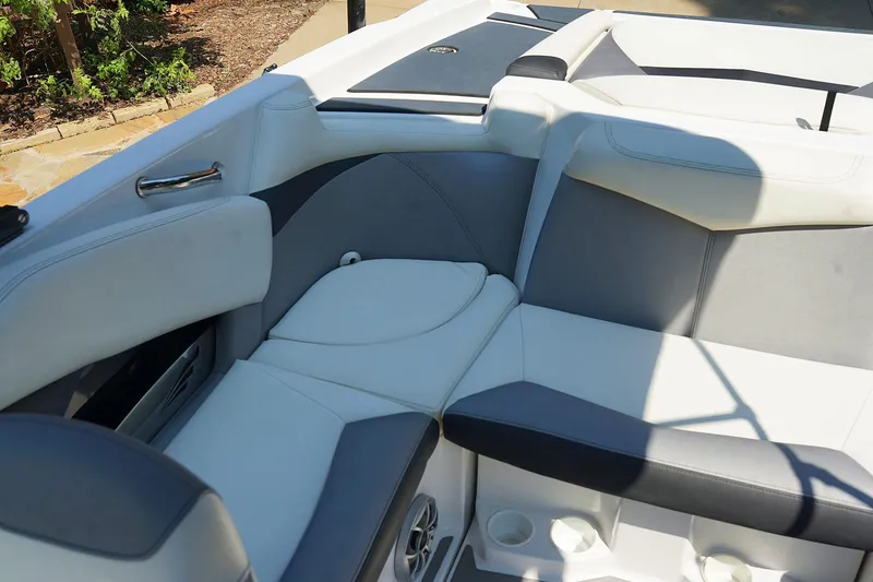 Slide: The Image of Interior of 2014 Tigé R20 boat with white and gray seating. - 22