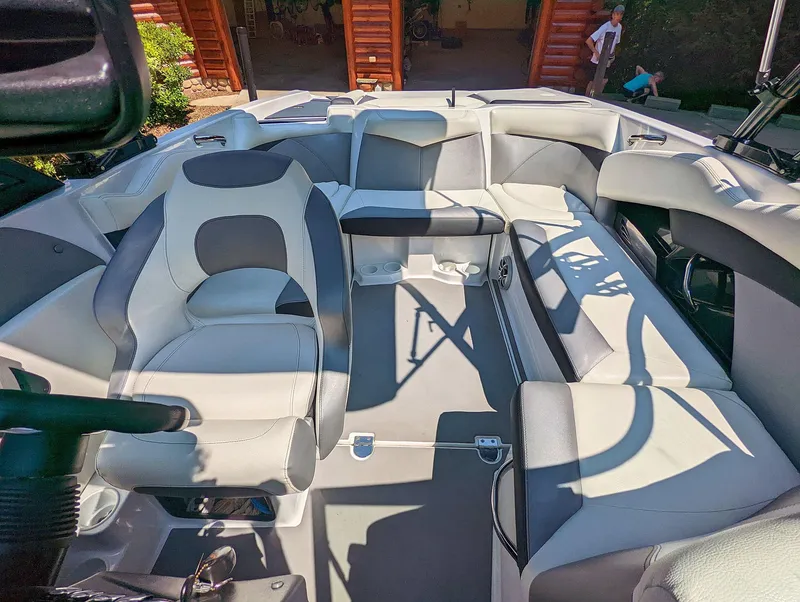 Slide: The Image of 2014 Tigé R20 boat interior with gray and white seating. - 3