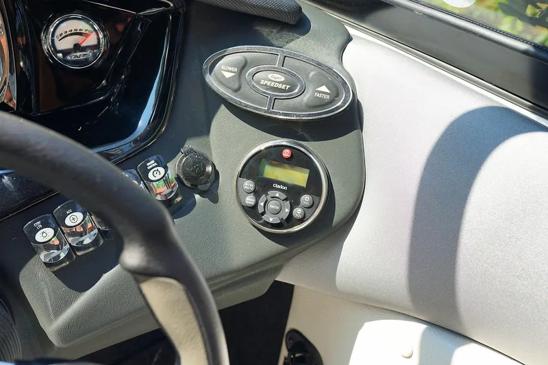 Slide: The Image of 2014 Tigé R20 boat dashboard with controls and gauges. - 30