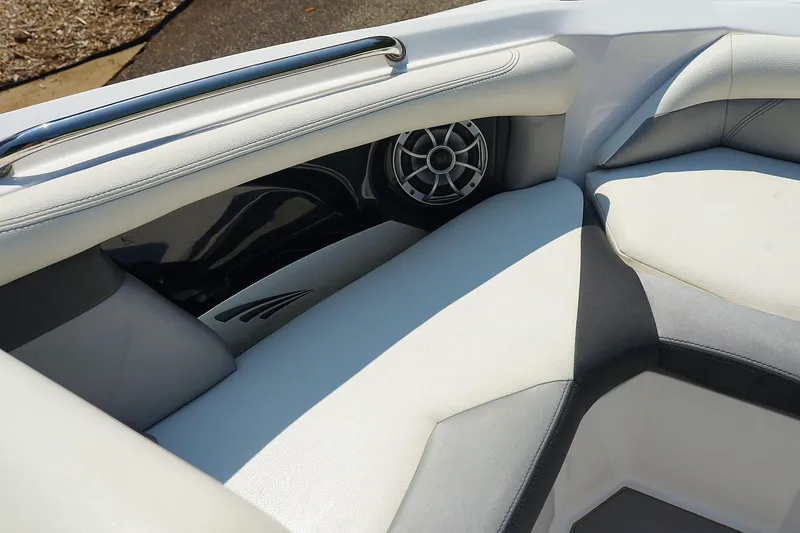Slide: The Image of 2014 Tigé R20 boat interior with white and gray seating and speaker detail. - 34