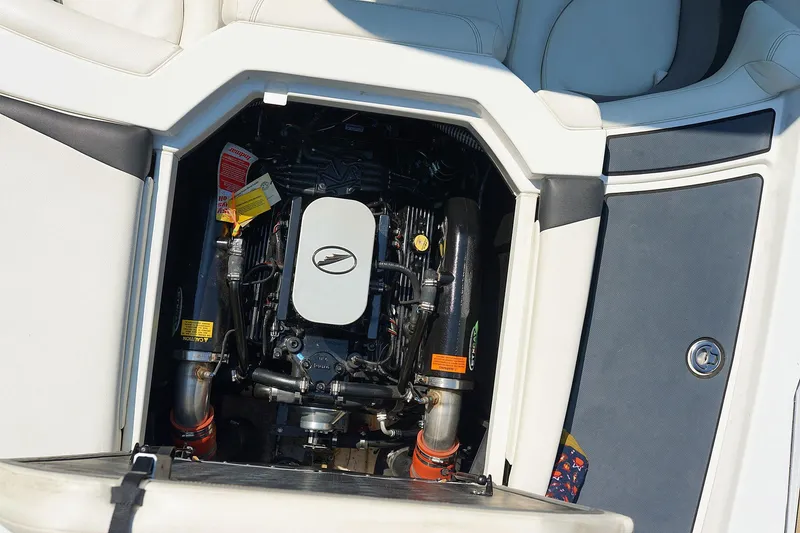 Slide: The Image of 2014 Tigé R20 boat engine compartment, showcasing detailed engine components. - 35