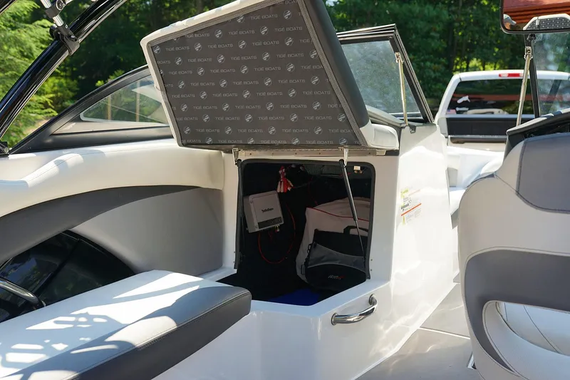 Slide: The Image of 2014 Tigé R20 boat interior storage compartment with open hatch. - 38