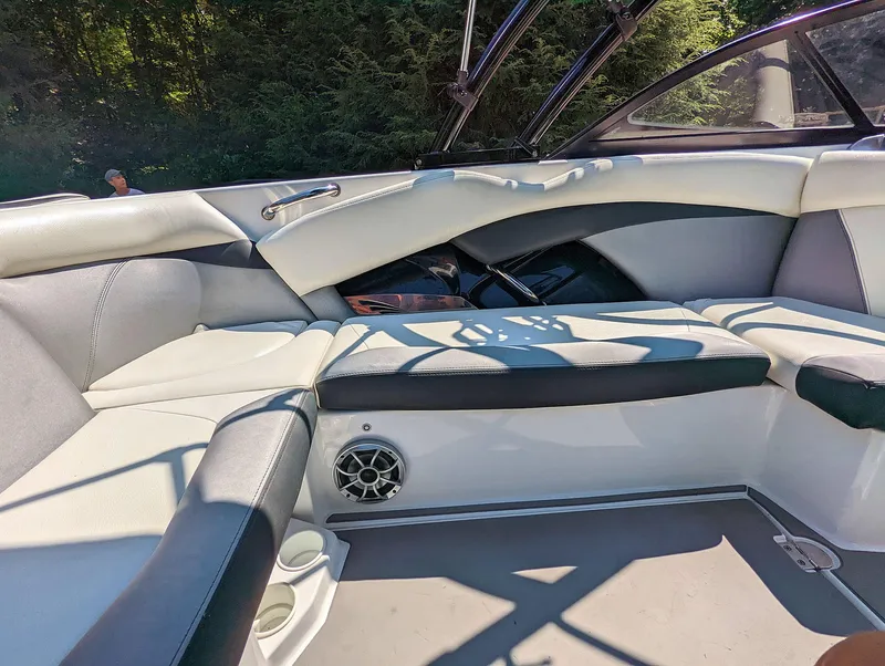 Slide: The Image of 2014 Tigé R20 boat interior with cushioned seating and speaker. - 4