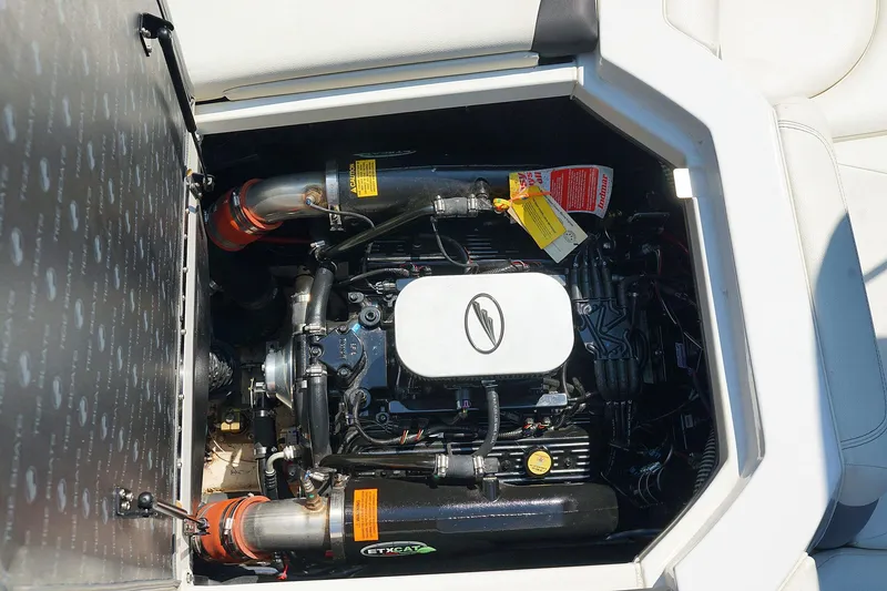 Slide: The Image of 2014 Tigé R20 boat engine compartment with visible components and labels. - 45